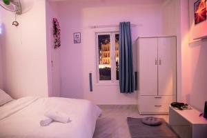 Rúm í herbergi á Bảo Dung Hotel