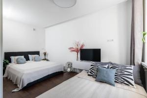 Posteľ alebo postele v izbe v ubytovaní Espresso Apartment Plac Mirowski