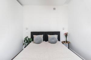 Posteľ alebo postele v izbe v ubytovaní Espresso Apartment Plac Mirowski