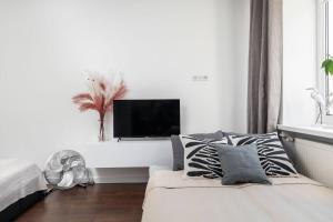 Posteľ alebo postele v izbe v ubytovaní Espresso Apartment Plac Mirowski