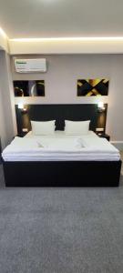 Postel nebo postele na pokoji v ubytování Hotel Tajikgrey Dushanbe