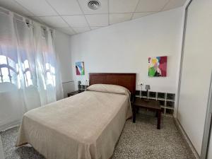 Posteľ alebo postele v izbe v ubytovaní Apartamentos Villa Torcal