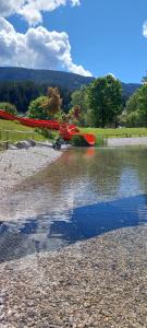 a couple of boats sitting on the shore of a lake at Appartements Haus Bergland in Sankt Martin am Tennengebirge