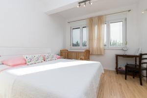 Postel nebo postele na pokoji v ubytování Apartmani Meriko