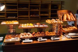 a bakery with a variety of breads and pastries on display at Tower Club at lebua in Bangkok