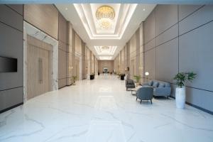 Posezení v ubytování HARRIS Hotel & Convention Cibinong City Mall Bogor + 37 fotografií