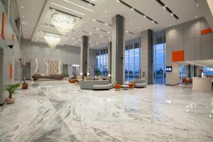 Posezení v ubytování HARRIS Hotel & Convention Cibinong City Mall Bogor
