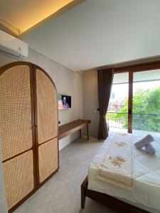 Postel nebo postele na pokoji v ubytování Cuan House Ubud