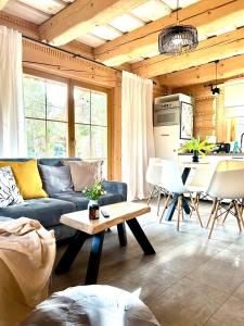 a living room with a couch and a table at Dom z drzew in Istebna