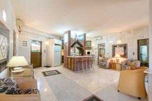 a large living room with a fireplace and a kitchen at Paco's Resort Luxury House 16 in Oziás