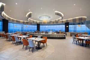 Restaurace v ubytování HARRIS Hotel & Convention Cibinong City Mall Bogor