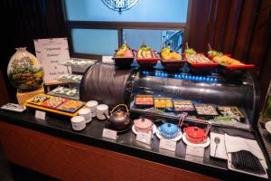 a buffet of food on display in a restaurant at lebua at State Tower in Bangkok