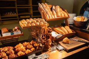 a bakery with lots of different types of bread at lebua at State Tower in Bangkok
