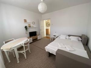 Postel nebo postele na pokoji v ubytování Apartmani Vidakovic