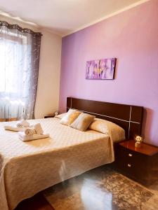 A bed or beds in a room at Appartamento Incantevole La Coccola