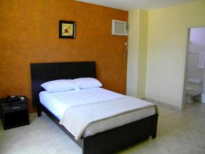 Voodi või voodid majutusasutuse Hotel Marvento II toas