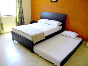 Voodi või voodid majutusasutuse Hotel Marvento II toas