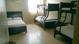 Voodi või voodid majutusasutuse Hotel Marvento II toas