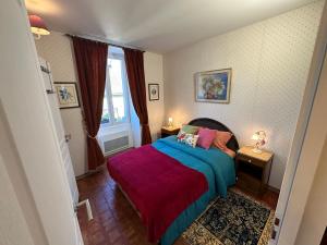 Кровать или кровати в номере Le Lodge de Serenite
