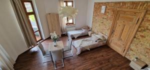 Ένα ή περισσότερα κρεβάτια σε δωμάτιο στο Goma Apartments