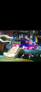 a water park with a pool with a water slide at مرسي مطروح in Marsa Matruh
