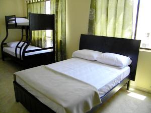 Voodi või voodid majutusasutuse Hotel Marvento II toas
