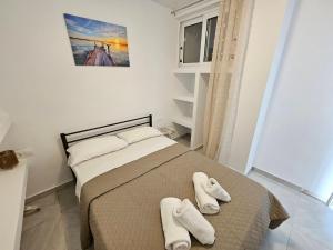 En eller flere senge i et værelse på CORFU ALINA'S APARTMENTS