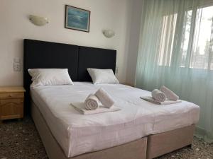 Postel nebo postele na pokoji v ubytování ANNA MARIA Studios