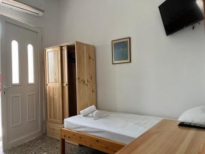 Postel nebo postele na pokoji v ubytování ANNA MARIA Studios