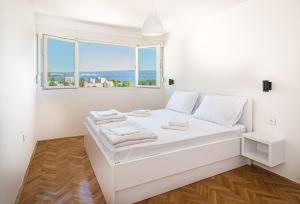 Ένα ή περισσότερα κρεβάτια σε δωμάτιο στο Skyline Suite