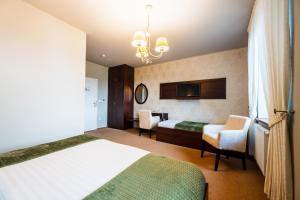Posteľ alebo postele v izbe v ubytovaní Hotel Plumlov