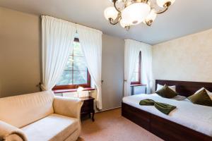 Posteľ alebo postele v izbe v ubytovaní Hotel Plumlov