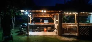 a shed at night with lights on it at Camping Kromidovo in Kromidovo
