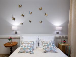 a bedroom with a bed with butterflies on the wall at LikeHome Apartment in Zagreb