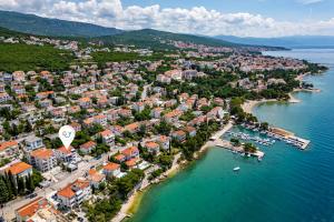 an aerial view of a town on the water at Spacious Pool Apartment Crikvenica - Happy Rentals in Crikvenica