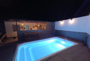 a large swimming pool in a room with at Limón Lunero in Málaga