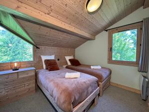 Ένα ή περισσότερα κρεβάτια σε δωμάτιο στο Chalet Tamara Clés Blanches Courchevel