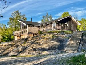 a house on top of a hill at Hällesdalens Gård - semesterhus i Bohuslän in Svenshögen