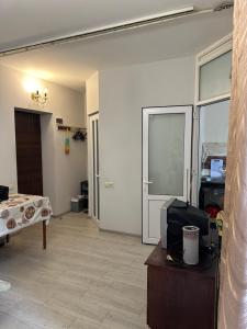 a room with a room with a bed and a table at Квартира одна-комнатная in Yerevan