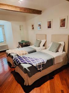 Ένα ή περισσότερα κρεβάτια σε δωμάτιο στο Le Dimore di Casa Mattei n°9