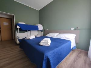 Postel nebo postele na pokoji v ubytování Hotel Montebello Riccione
