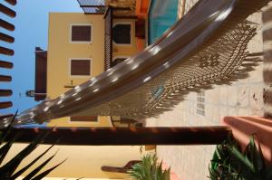 a close up of a metal roof on a building at El Mosaico Del Sol in Lampedusa