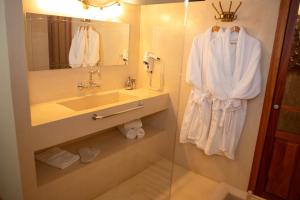 a bathroom with a sink and a mirror at Hotel Boutique Posada Castañeda in Granada +24 photos