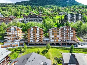 an aerial view of a city with buildings at Apartment Grand Panorama A11 by Interhome in Nendaz
