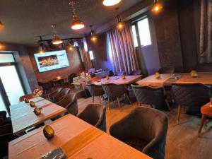 a dining room with wooden tables and chairs at Pino - Villa, Casa, Cucina е Terrazza in Albena