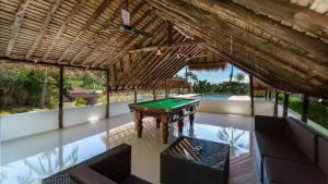 an indoor pool with a pool table in a house at Villa VV Lamai Koh Samui in Koh Samui 