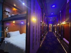 Postelja oz. postelje v sobi nastanitve Attic Capsule Hotel