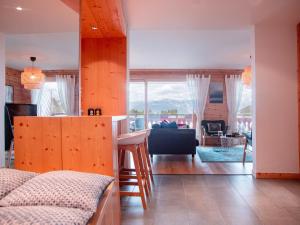 a kitchen and living room with a view of the mountains at Apartment Jade 22 by Interhome in Villars-sur-Ollon