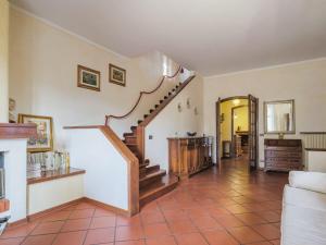 a living room with a staircase in a house at Holiday Home Orchidea by Interhome in Camaiore