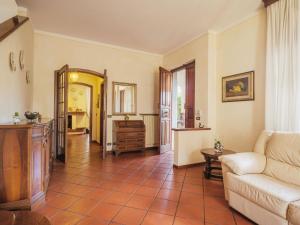 a living room with a couch and a table at Holiday Home Orchidea by Interhome in Camaiore +36 photos